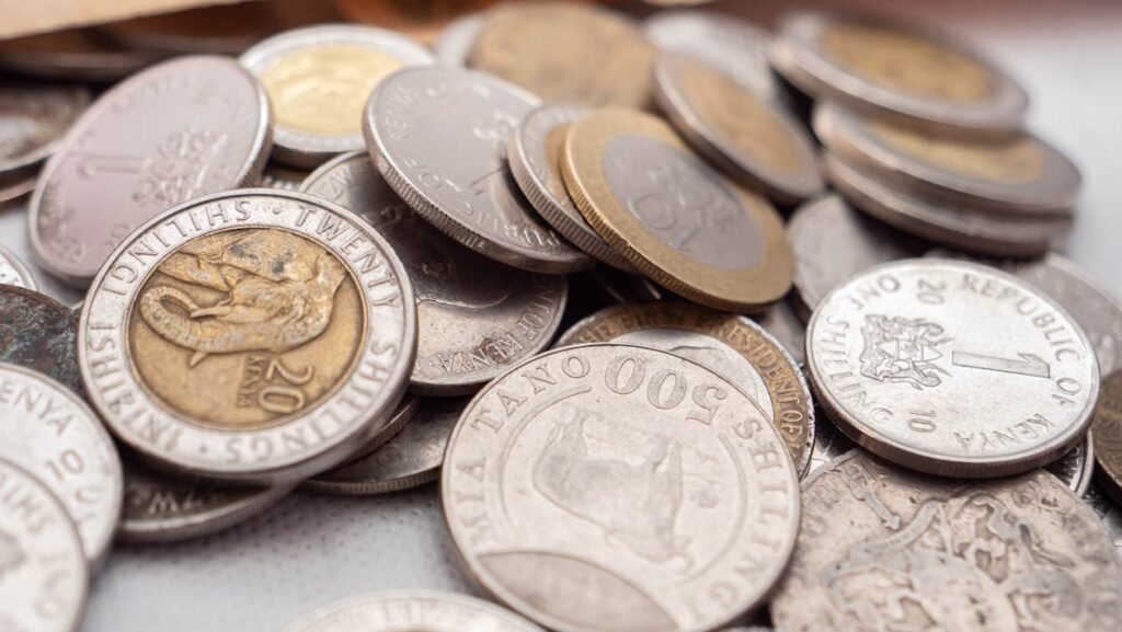 Close-up of Kenyan shilling coins representing money market fund investments